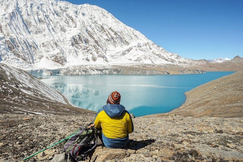 Travel,Concept:,Trekker,With,Tourist,Sticks,And,Backpack,On,Tilicho