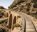 Tracks,Passing,Over,A,Stone,Railway,Bridge,Just,Outside,Of