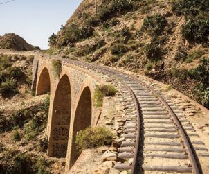 Tracks,Passing,Over,A,Stone,Railway,Bridge,Just,Outside,Of